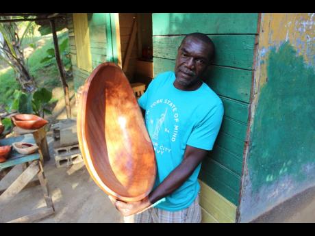 Winston Joseph of Aleppo, St Mary displays one of his bigger bowls made from cedar wood.