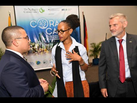 Senator Matthew Samuda (left) minister without portfolio in the Ministry of Economic Growth and Job Creation with responsibility for the environment, speaks with Nickie Myers, general manager of the Alligator Head Foundation, and Jan Hendrik van Thiel, Ger