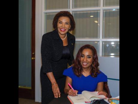 Dr Monique Rainford (seated) and Ambassador Audrey Marks at her book signing for ‘Pregnant While Black’ in Washington, DC, recently.