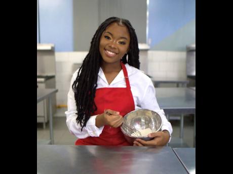 Deboneil Brissett mixing ingredients for one of her products.