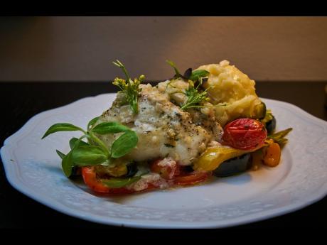 Main course: oven-roasted fish served with Mediterranean-roasted vegetables with mashed potatoes and a  white wine sauce.