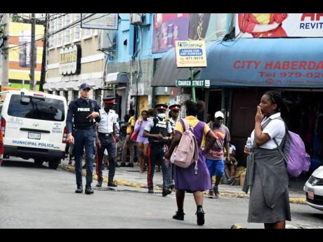 A police team patrols the streets of downtown MoBay