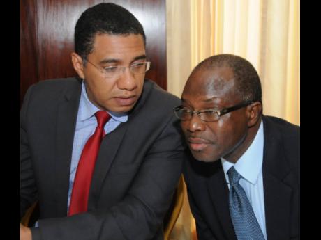 Prime Minister Andrew Holness (left) and Everald Warmington, minister without portfolio in the Office of the Prime Minister.