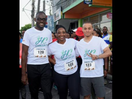 President of the Montego Bay Chamber of Commerce and Industry Oral Heaven (left), poses with Aldria Grant and Aldane Thompson.