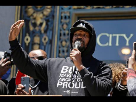 Jamie Foxx speaks to a large crowd during a “kneel-in” to protest police racism on the steps of City Hall Monday, June 1, 2020, in San Francisco. 