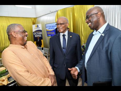 Guest speaker Dr Patrick Prendergast (left), campus director, UWI, Mona, Western Jamaica Campus. shares a hearty laugh with Gary Allen (right), CEO of RJRGLEANER Communications Group, and Professor Sir Kenneth Hall, former governor general, at the J.A. Les