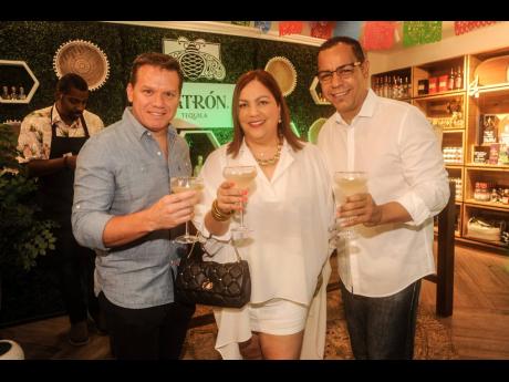 From left: Franklin Murillo, Ana Olivero and Juan Baez indulge in Cinco de Mayo staples ... margaritas.