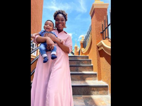 New mother, Shamara Spencer, who has since taken baby steps back to her active career, poses proudly with her baby boy bundle of joy.