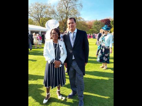 Erma Lewis (left), a community champion from Birmingham, and Port Royal Patties CEO Edward Johnson are pictured at the arden Party at Buckingham Palace.