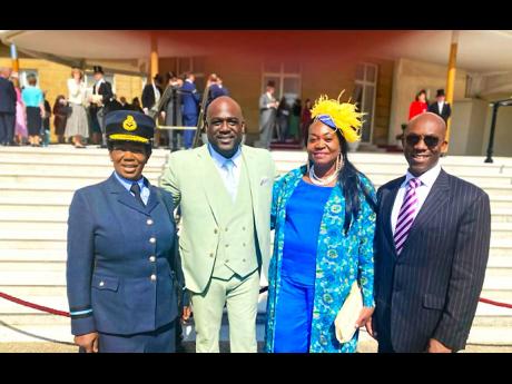 From left: Dr Marcia McLaughlin, Royal Airforce air commander, son Mark Dwayne, socialite Dorothy Ottey and community activist Rudi Page were among some of the guests at the garden party at Buckingham Palace.