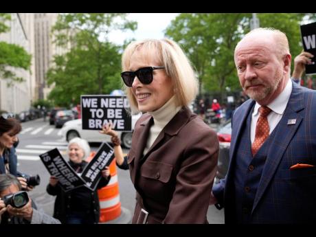 E. Jean Carroll arrives at Manhattan federal court in New York yesterday. 