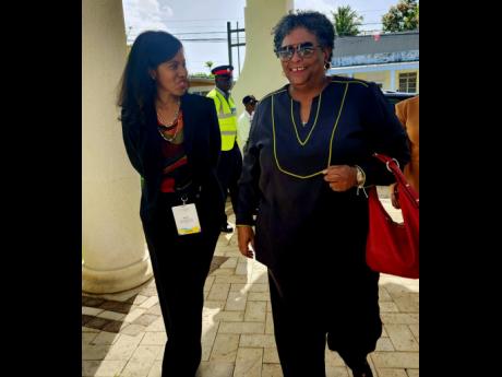 Prime Minister of Barbados Mia Mottley (right) being met on arrival at Sandals Royal Barbados’ Conference Centre by president of the Caribbean Hotel and Tourism Association (CHTA), Nicola Madden-Greig. Mottley gave the keynote address at the CHTA Travel 