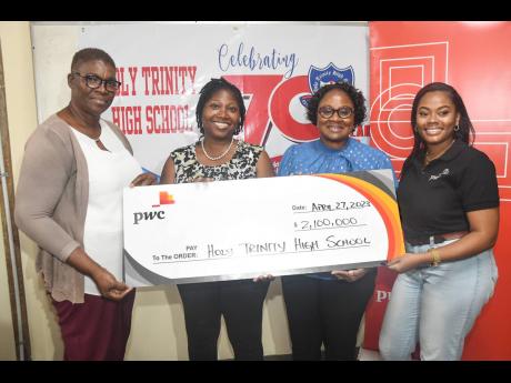 Carolyn Bell-Wisdom (second left), partner and ESG lead at PwC Jamaica, and Dana Coley (right), senior associate, advisory at PwC Jamaica, present a symbolic cheque for $2.1m to vice-principals Ivy Reid (left) and Beneze Barker-Dunn of  Holy Trinity High S
