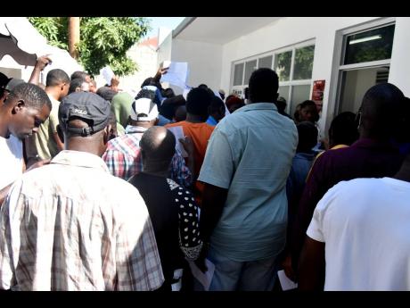 Motorists crowd the Kingston Traffic Court Tuesday ahead of the January 31 deadline for unpaid traffic tickets to be cleared. 