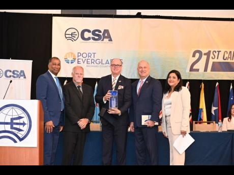 Mayor of Broward County Lamar P. Fisher (centre) and Port Everglades CEO and Port Director Jonathan T. Daniels (second right) accept a token from the Caribbean Shipping Association’s executives (from left), Vice-President William Brown, President Marc Sa