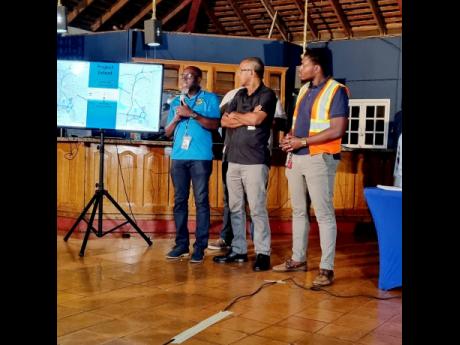 From left: Communication Manager at the National Works Agency, Stephen Shaw. Project Manager Orville Reynolds and traffic engineer Michael Reid explain new traffic changes in the Mandeville Traffic management development plan at the Manchester Chamber of C