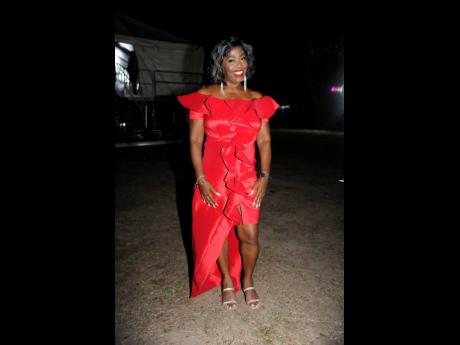 The woman of the moment, June Isaacs, widow of Gregory Isaacs, represents in none other than red.