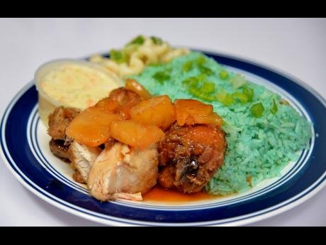 Would you try blue rice? It is served with pineapple fried chicken and the famous jackfruit coleslaw.