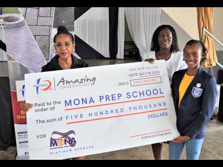 Angela Amir (left), director, Amazing Concrete Finishes Limited, presents a sponsorship cheque for $500,000  to Citrine Dixon (centre), acting principal of Mona Prep, and Soleil Blake, head girl and track team member. The presentation took place during yes
