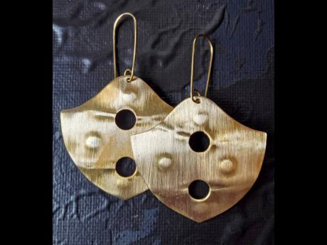 Here is a unique pair of earrings for Gordon-Johnson’s handmade’s brass collection.