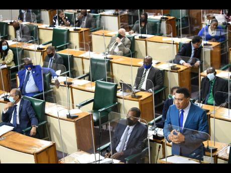 In this June 2021 photo Prime Minister Andrew Holness speaks at the sitting of the House of Representatives. 