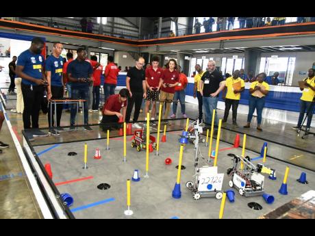 In this February photo, students from Munro College and Carol Morgan High School, Dominican Republic, compete in a robotics competition at Jamaica College.