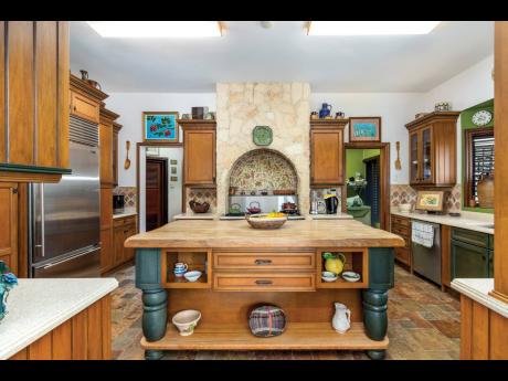 A stunning island kitchen with handcrafted Italian tiles.