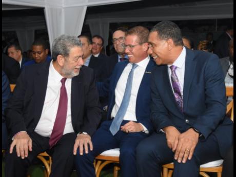 Prime Minister Andrew Holness (right) shares lens with Dr Ralph Gonsalves, prime minister of St Vincent and the Grenadines (left), and Adam Stewart, executive chairman, Sandals Resorts International.