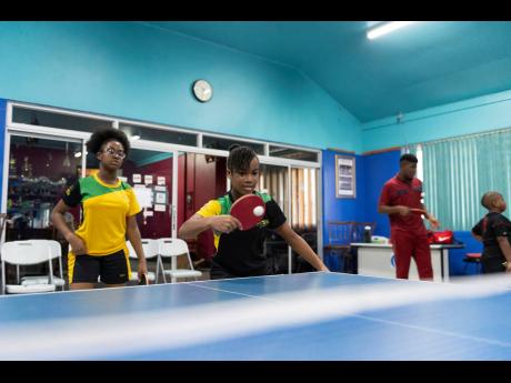 
Sisters Gianna Lewis (left) and Tsenaye Lewis of the Jamaica National table tennis team at a training session on Thursday July 11, 2019 at The Gleaner Company (Media) Limited’s sports club.