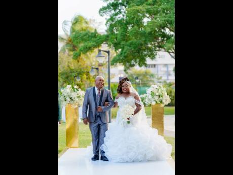 The father of the bride, Deputy Mayor of Kingston Winston Ennis, was honoured to walk his beautiful daughter up the ailse to say ‘I do’ to her beloved.