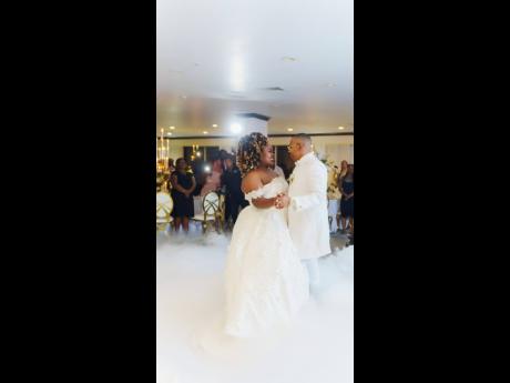 On cloud nine, this loving couple went from sharing a first dance at the dry cleaners when they first met, to sharing a first dance as husband and wife.