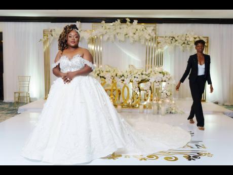 Upon the recommendation of her hairstylist, the bride was put on to Jamaican dress designer Renea Brown (right), owner of REbirth Couture. Together, she and Brown designed not one, but two stunning wedding gowns.