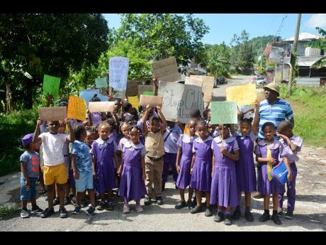 Pisgah Primary and Infant School students take part in their demonstration against child abuse last Friday.