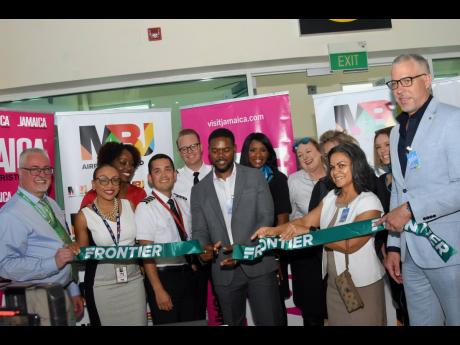 Deputy Mayor of Montego Bay Richard Vernon (centre) at the official ribbon-cutting ceremony to celebrate Frontier Airlines’ inaugural flight from Dallas-Fort Worth International Airport in Dallas, Texas, to the Sangster International Airport in Montego B