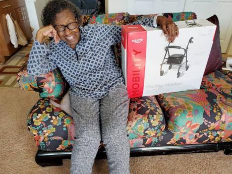 An elderly resident is all smiles after she received a well needed rolling walker from Hearts and Hands United, at the non-profit organisation’s annual Christmas mingle. 