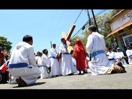 In this 2018 photo Brother, Roche Tulalian, from the Missionaries of the Poor, carries a cross on Good Friday. Ronald Thwaites writes: ‘Several [readers] were uncomfortable with the ideal of  simple living. “You want everybody to be like Mother Teresa 
