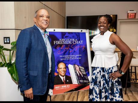 Dr Ewart Brown (left), former premier of Bermuda, sharing a moment with the co-host of his Fireside Chat on Friday, Chorvelle Johnson Cunningham, chief executive officer, Sagicor Bank. 