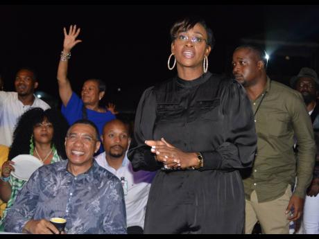 Prime Minister Andrew Holness (left), enjoys the music with wife, Juliet, member of parliament for East Rural St Andrew.