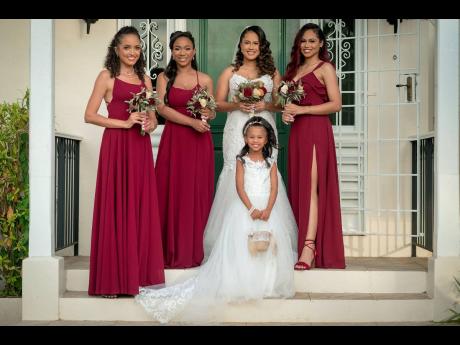 With style and grace, the bridesmaids join their bride on her walk to become Mrs Facey. From left: Bridemaid Monique Brady; Janelle Campbell; the bride Vanassa Metzger Facey; Nastassia Metzger, maid of honour and sister of the bride and Khara Facey, flower