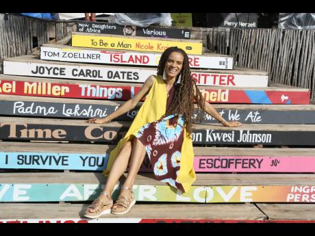 Yashika Graham, poet and Kool announcer, could not miss the chance to snap a picture on these iconic Calabash book spine steps.