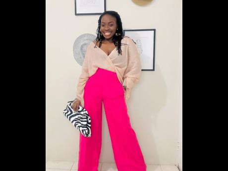 Because Davis desired an outfit in hues of pink, she got creative using a scarf to make a top. She paired the piece with a pair of wide leg pants from Shein and a statement bag from Amazon Fashion.
