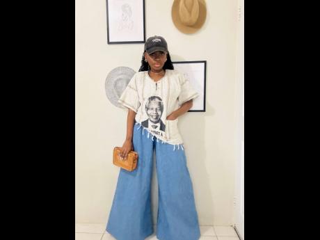 Anyone who knows Davis knows she’s a lover of Africa and its culture. When she visited South Africa a few years ago, she grabbed this top of the country’s former president, Nelson Mandela. She paired the statement top with a wide leg denim and a cap. 