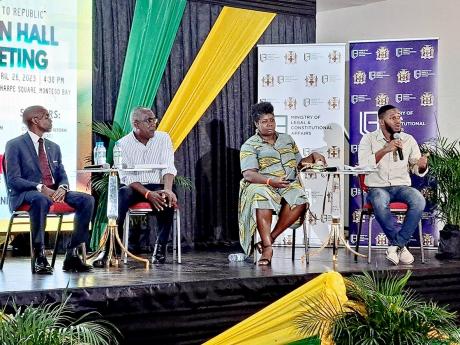 Sujae Boswell (right), a member of the Constitutional Reform Committee, addresses a town hall meeting to discuss the first phase of the constitutional reform process, held at the Montego Bay Cultural Centre in St James on April 26. Also pictured, from left