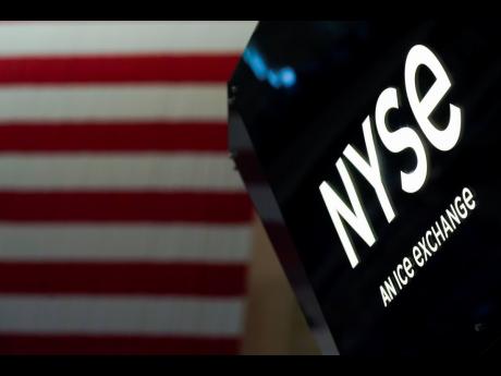 An NYSE sign is seen on the floor at the New York Stock Exchange in New York on June 15, 2022.