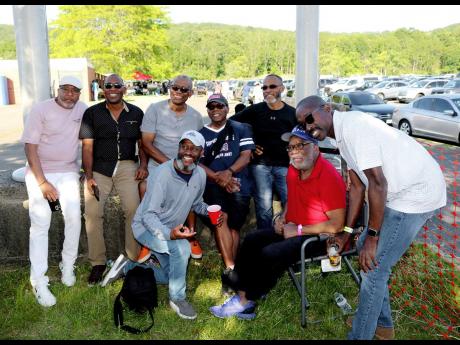 Founding member of the Trelawny Reunion Picnic, D.K. Mullings (seated), shares a light moment with a group of Falmouthians (from left); President of Friends of Falmouth Michael Wattkis, former Mayor of Falmouth and Councillor for the Falmouth Division, Gar