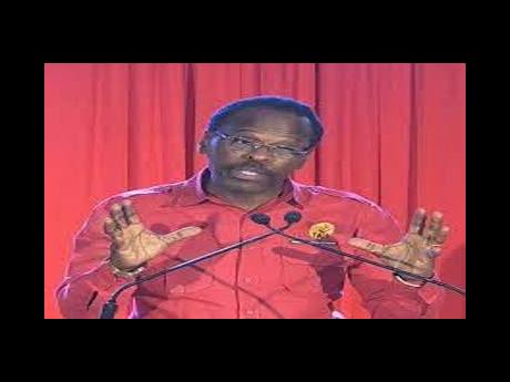 National Security Minister Fitzgerald Hinds addressing a People’s National Movement public meeting on Thursday night.