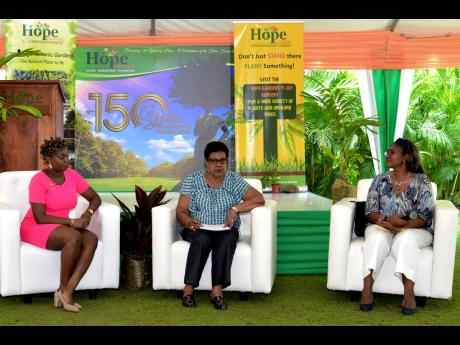 Eleanor Jones (centre), chairman and CEO, Environment Solutions Limited, explains the importance of green space during the Nature Preservation Foundation public forum on Wednesday at Hope Botanical Gardens. Looking on are Dainalyn Swaby (left), climate com