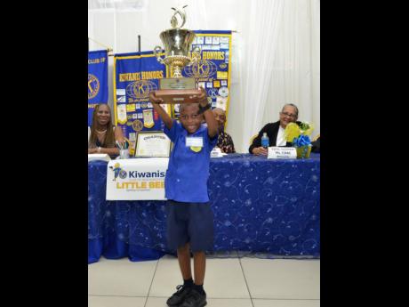 Little Bee Spelling Competition Champion Zayne Thomas of Junior World Learning and Activity Centre celebrates his win. 