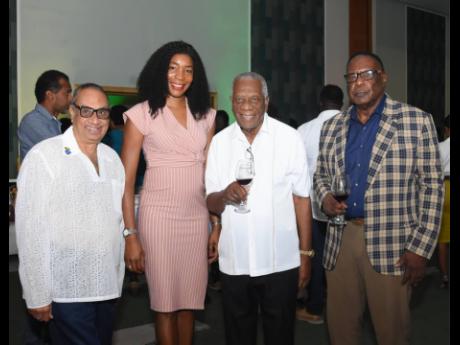  Lachu Ramchandani (left) managing director at Blue Diamond Shopping Mall shares lens with Paula Powell, Jamaica Tourist Board; Godfrey Dyer, chairman of the Tourism Enhancement Fund; and Leeroy Williams, mayor of Montego Bay at the Reggae Sumfest Media La