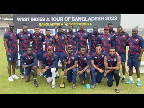 
Members of the West Indies A team pose with the winner’s trophy after their series win against Bangladesh A. 